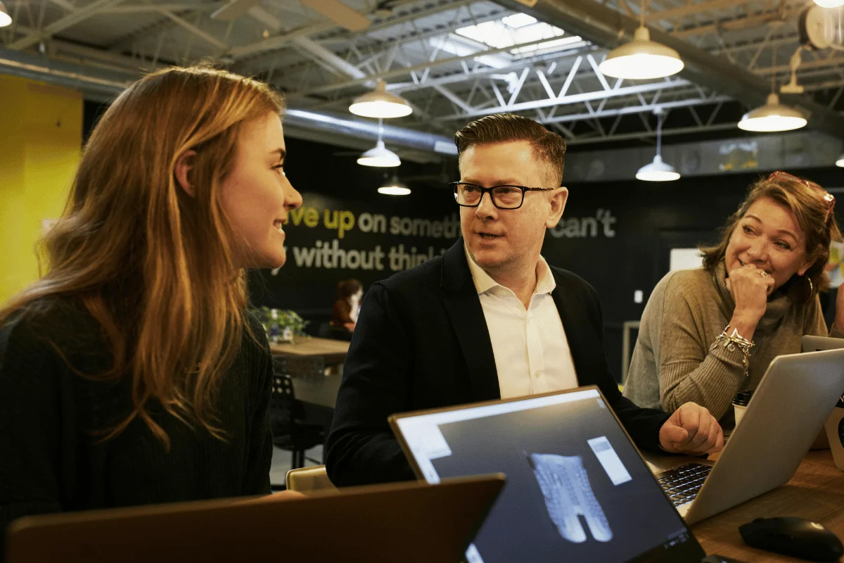 Team having a casual business discussion in modern office.